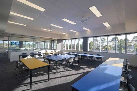 Bright school classroom set up for small-group tutoring sessions
